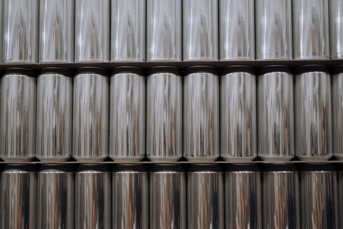 Rows of empty aluminium drink cans stacked at the facility